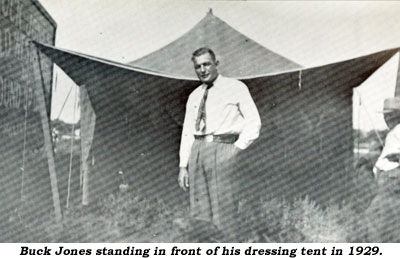 Buck Jones standing in front of his dressing tent in 1929.