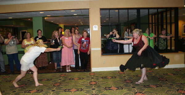 It was water guns at ten paces as a Lancer Lady (left) faced off against a Virginian Posse member for some afterhours fun at the Whispering Woods bar.