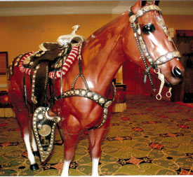 Pam Weidel and John B. Haines displayed the Trigger Jr. Bohlin-made saddle they purchased at the Roy Rogers auction. The horse display in the hotel lobby was provided by Cowboy Corner of Olive Branch.