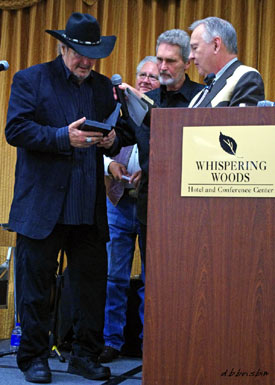 William Smith with his “Gathering of Guns 3” award, presented by Boyd Magers, John Buttram and friend Robert Wolders.