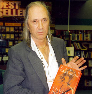 David (“Kung Fu”) Carradine holds his autobiography, ENDLESS HIGHWAYS, at a Albuquerque, New Mexico book signing in 1995.