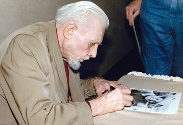 Bob Livingston signs an autograph at the Atlanta Film Caravan in 1985.