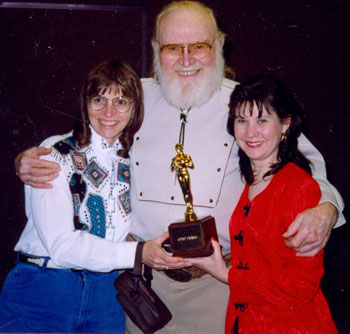 Donna Magers and Bonnie Boyd present Gene Evans with his award at the 1997 Knoxville Film Festival.