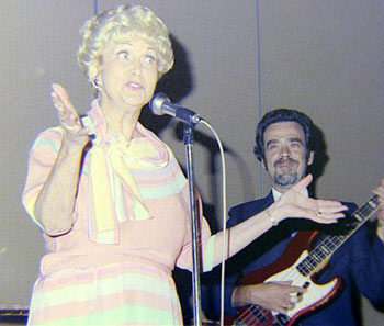 Lovely Beth Marion sings “I Don’t Know Why I Love You Like I Do” at the Memphis Film Festival banquet in 1985. The late Tommy Floyd accompanies her on guitar. (Thanx to Grady Franklin.)