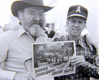 Gene Evans holds up a lobby card from “Under Colorado Skies” (‘47 Republic) with Monte Hale, one of Gene's earliest films. It was presented to Gene by stuntman Neil Summers at the Memphis 1984 Film Festival. (Thanx to Grady Franklin.)