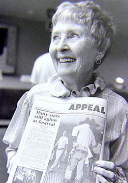 The wonderful Marion Shilling holds up a newspaper article about the Memphis Film Festival she was attending in 1985. (Thanx to Grady Franklin.)