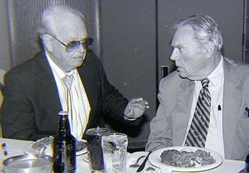 Walter Reed seems “dubiously stunned” at whatever Rex Allen is telling him over dinner at the Knoxville Western Film Fair in 1990. (Thanx to Grady Franklin.)