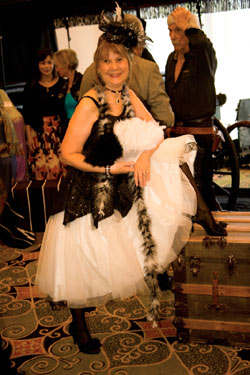 Bonnie Boyd vamped it up for the banquet as a saloon girl. L.Q. Jones, Roberta Shore and Diane Roter in the background.