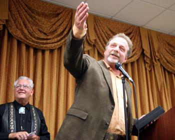 Darby Hinton thanks the group for his award. John Buttram behind him.