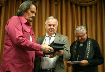 Boyd Magers and John Buttram present an award to the son of “The Rifleman” Jeff Connors.