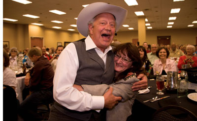 Rex gives a big hug to Carol Ann Kellum during his performance. 