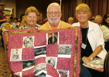 Tony Joynt (center) and his fiancee Yoland Mullenix (right) purchased the “Cheyenne” quilt made by Donna Wilmeth (left) at auction just prior to the Clint Walker panel discussion.