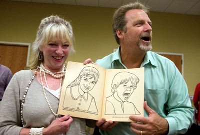 Veronica and Darby recreate their likenesses seen in a ‘60s “Daniel Boone” coloring book given to Darby at the festival by photographer Steve St. John.