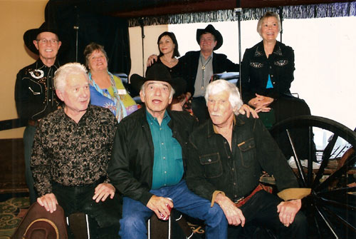 This was the 50th anniversary of “The Virginian” and we gathered eight members of the cast together: (Top row l-r): Don Quine, Sara Lane, Diane Roter, Randy Boone, Roberta Shore. (Front row l-r): Gary Clarke, James Drury, L.Q. Jones.