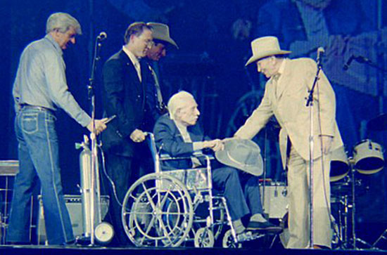 Gene Autry welcomes Robert Livingston to the stage to receive his Golden Boot Award in 1987. (Photo by Grady Franklin.)