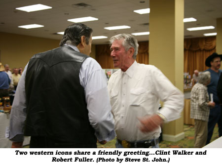 Two western icons share a friendly greeting...Clint Walker and Robert Fuller. (Photo by Steve St. John.)