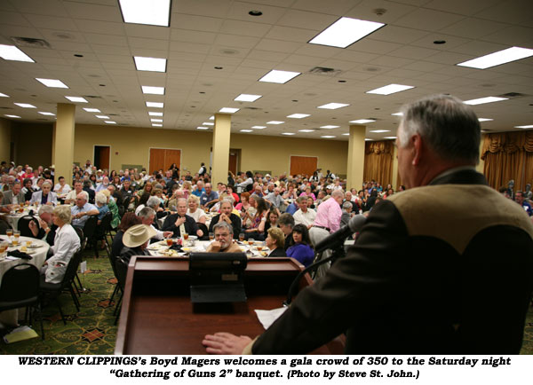 WESTERN CLIPPINGS' Boyd Magers welcomes a gala crowd of 350 to the Saturday night "Gathering of Guns 2" banquet.  (Photo by Steve St. John.)