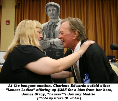 At the banquet auction, Charlene Edwards outbid other "Lancer Ladies" offering up $285 for a kiss from her hero, James Stacy, "Lancer"'s Johnny Madrid.  (Photo by Steve St. John.)