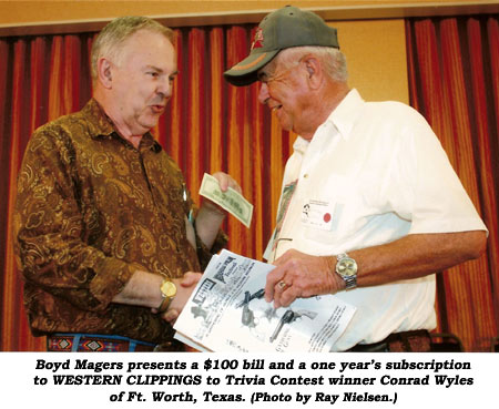 Boyd Magers presents a $100 bill and a one year's subscription to WESTERN CLIPPINGS to Trivia Contest winner Conrad Wyles of Ft. Worth, Texas.  (Photo by Ray Nielsen.)