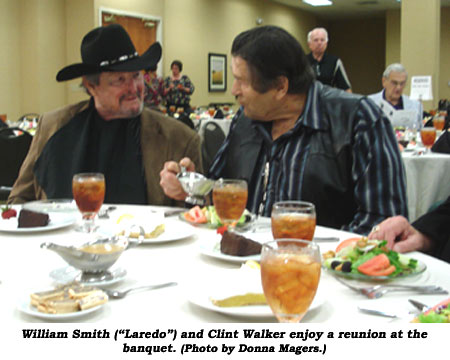 Willaim Smith ({"Laredo") and Clint Walker enjoy a reunion at the banquet.  (Photo by Donna Magers.)