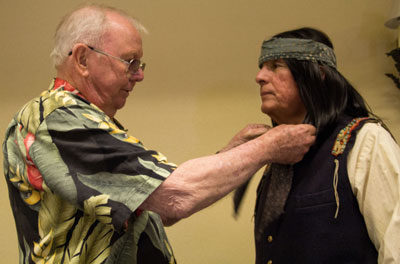 Costumer Luster Bayless readies Rudy Ramos (Wind on “High Chaparral”) for his marvelous presentation as Geronimo following a panel discussion.