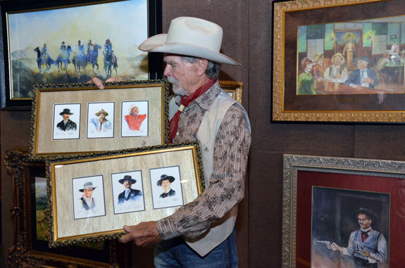 Buck Taylor displays just some of his wonderful artwork.