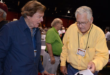 Edd Byrnes and John Buttram in deep discussion. Festival promoter Ray Nielsen in the background.