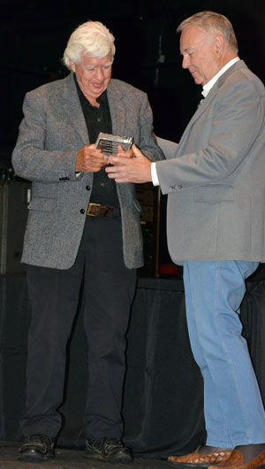Boyd Magers presents an award to Clu Gulager.