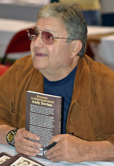 Dennis Devine with his book about his father Andy.