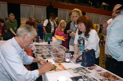 Bob Fuller signs autographs for his many fans.