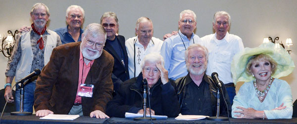 The radio re-creation cast: (Standing) Buck Taylor, Robert Colbert, Dennis Devine, Boyd Magers, John Buttram, Robert Fuller. (Front) Director Gary Yoggy, Clu Gulager, Michael McGreevey, Ruta Lee.