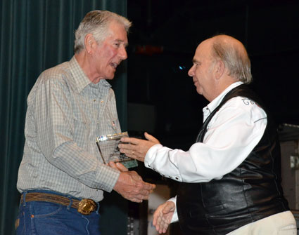 Bob Fuller accepts his award from Ray Nielsen.