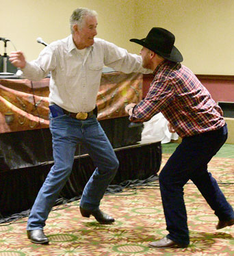 Bob Fuller and friend Tony Gill demonstrate the camera techniques in staging an onscreen stunt fight.