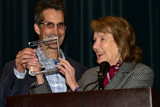 Julie Adams accepts her festival award along with son Mitch Danton.