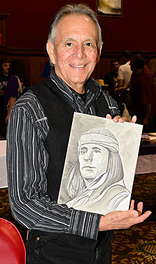 Rudy Ramos displays a fan’s artwork of Rudy as Geronimo.