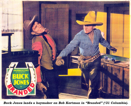 Buck Jones lands a haymaker on Bob Kortman in "Branded" ('31 Columbia).