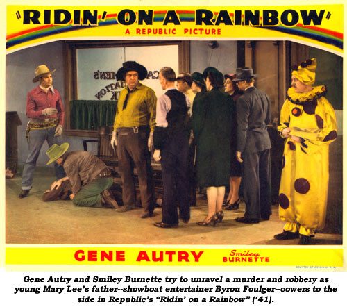 Gene Autry and Smiley Burnette try to unravel a murder and robbery as young Mary Lee's father--showboat entertainer Byron Foulger--cowers to the side in Republic's "Ridin' on a Rainbow" ('41).