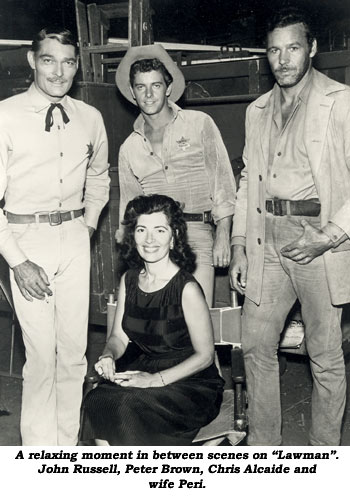 A relaxing moment in between scenes on "Lawman". John Russell, Peter Brown, Chris Alcaide and wife Peri.