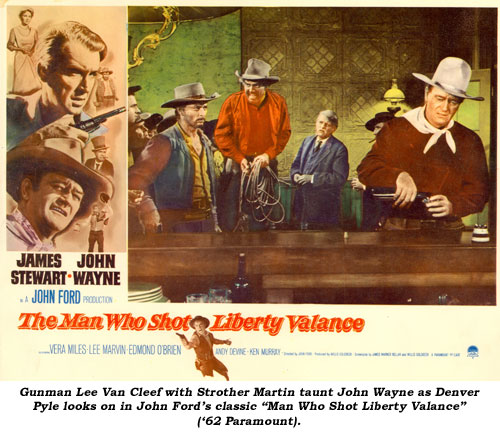 Gunman Lee Van Cleef with Strother Martin taunt John Wayne as Denver Pyle looks on in John Ford's classic "Man Who Shot Liberty Valance" ('62 Paramount).