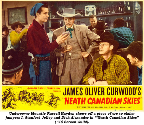 Undercover Mountie Russell Hayden shows off a piece of ore to claimjumpers I. Stanford Jolley and Dick Alexander in "'Neath Canadian Skies" ('46 Screen Guild).