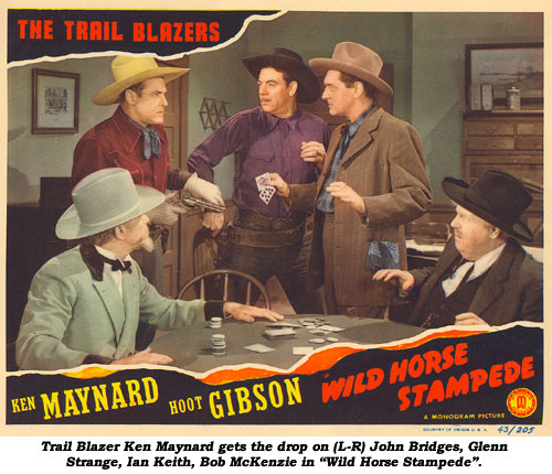 Trail Blazer Ken Maynard gets the drop on (L-R) John Bridges, Glenn Strange, Ian Keith, Bob McKenzie in "Wild Horse Stampede."