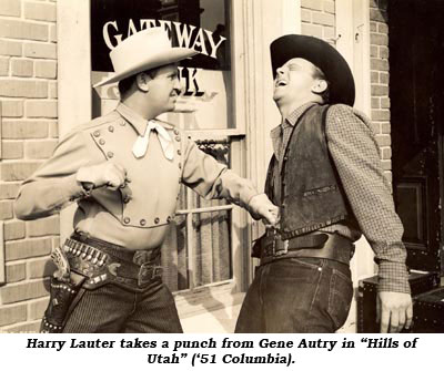 Harry Lauter takes a punch from Gene Autry in "Hills of Utah" ('51 Columbia).