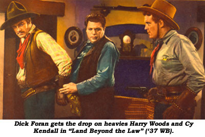 Dick Foran gets the drop on heavies Harry Woods and Cy Kendall in "Land Beyond the Law" ('37 WB).