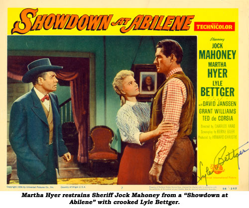 Martha Hyer restains Jock Mahoney from a "Showdown at Abilene" with crooked Lyle Bettger.