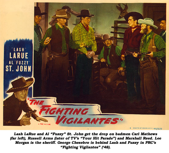 Lash LaRue and Al "Fuzzy" St. John get the drop on badmen Carl Mathews (far left), Russell Arms (later of TV's "Your Hit Parade") and Marshall Reed. Lee Morgan is the sheriff. George Chesebro is behind Lash and Fuzzy in PRC's "Fighting Vigilantes" ('48).