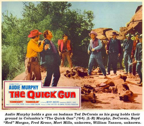 Audie Murphy holds a gun on badman Ted DeCorsia as his gang holds their ground in Columbia's "The Quick Gun" ('64). (L-R) Murphy, DeCorsia, Boyd "Red" Morgan, Fred Krone, Mort Mills, unknown, William Tannen, unknown.