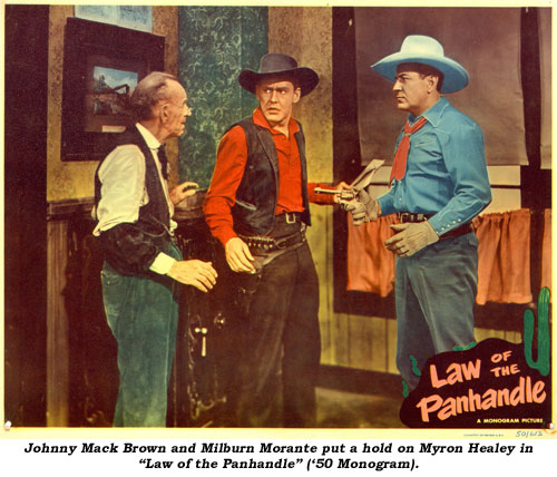 Johnny Mack Brown and Milburn Morante put a hold on Myron Healey in "Law of the Panhandle" ('50 Monogram).