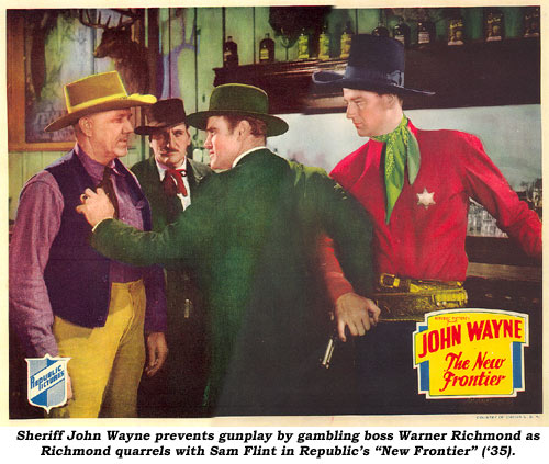 Sheriff John Wayne prevents gunply by gambling boss Warner Richmond as Richmond quarrels with Sam Flint in Republic's "New Frontier" ('35).
