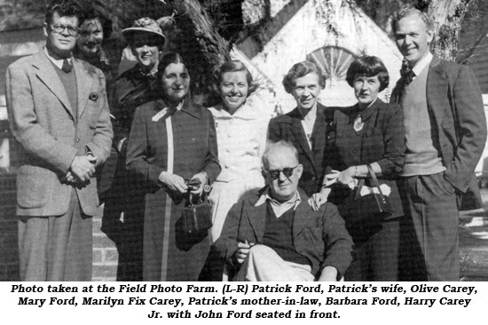 Photo taken at the Field Photo Farm. (L-R) Patrick Ford, Patrick's wife, Olive Carey, Mary Ford, Marilyn Fix Carey, Patrick's mother-in-law, Barbara Ford, Harry Carey Jr. with John Ford seated in front.