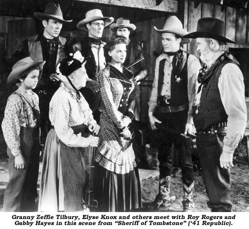 Granny Zeffie Tilbury, Elyse Knox and others meet with Roy Rogers and Gabby Hayes in the scene from "Sheriff of Tombstone" ('41 Republic).